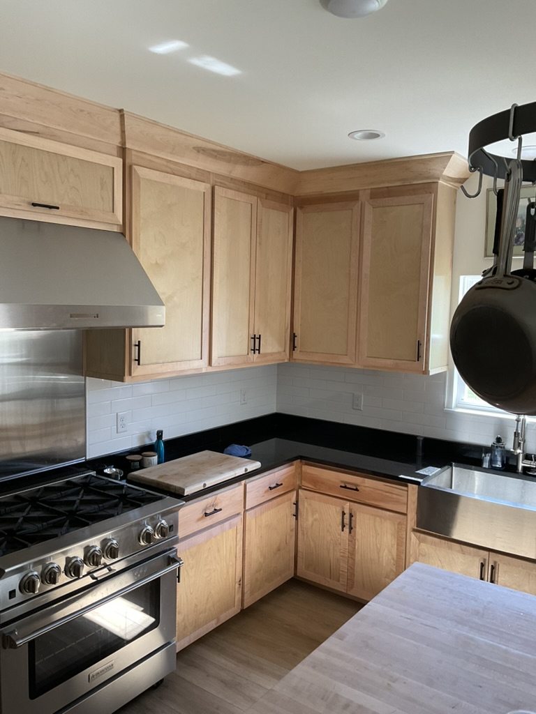 Shadow Point range wall with custom upper and lower cabinets